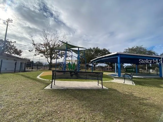 a view of a park with swings and slides