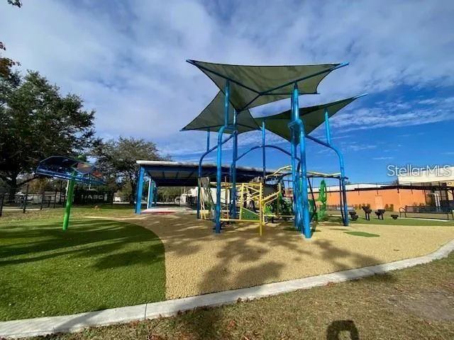 a view of a table and chairs under an umbrella
