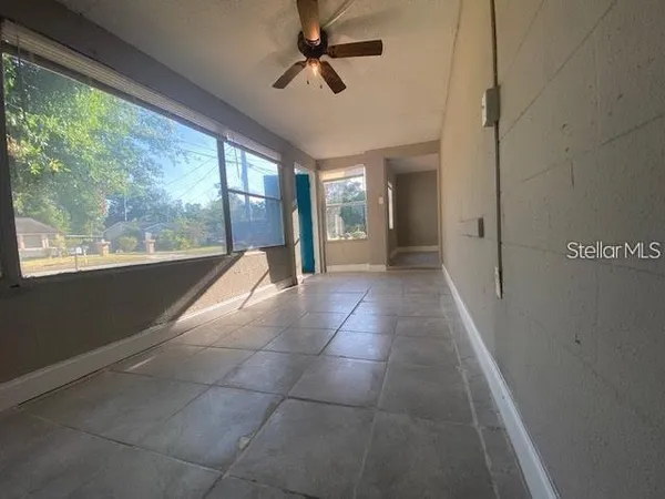 a view of hallway with windows