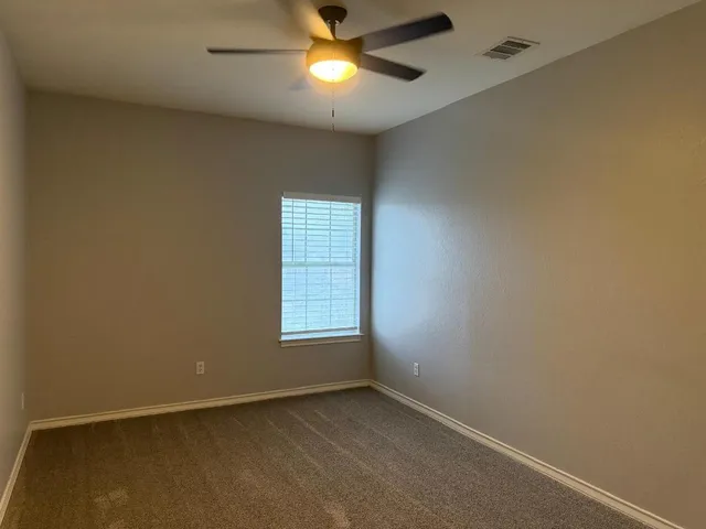 a view of yard with patio