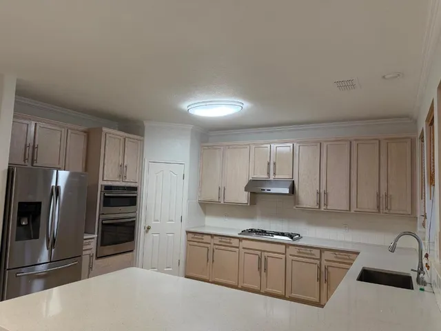 a bathroom with a sink a vanity and a window