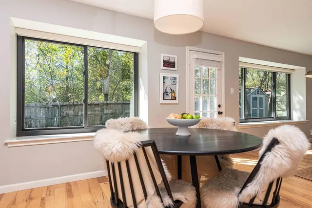 a view of a dining room with furniture window and outside view