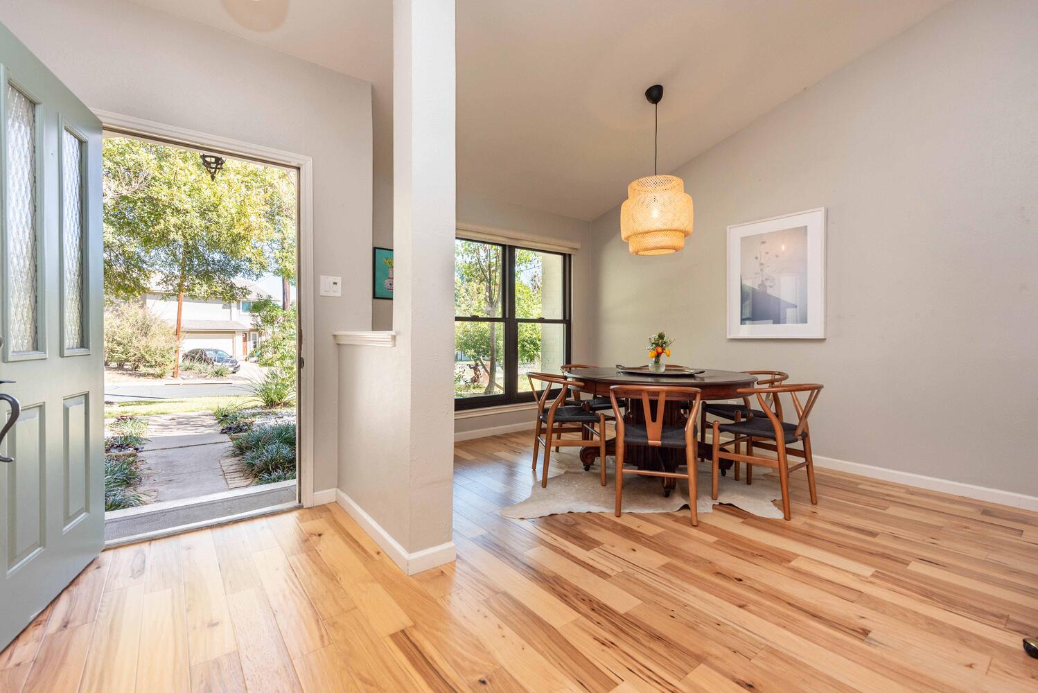 3403 Palomar Lane Austin, TX 78727 - Photo 18 of 33 Dining room featuring vaulted ceiling and light wood-type flooring
