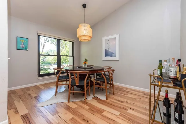 a view of a dining room with furniture window and wooden floor