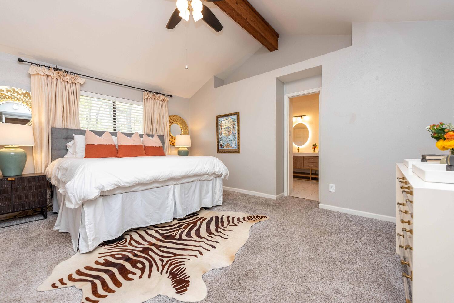 3403 Palomar Lane Austin, TX 78727 - Photo 21 of 33 Bedroom with light carpet, a ceiling fan, and ensuite bathroom