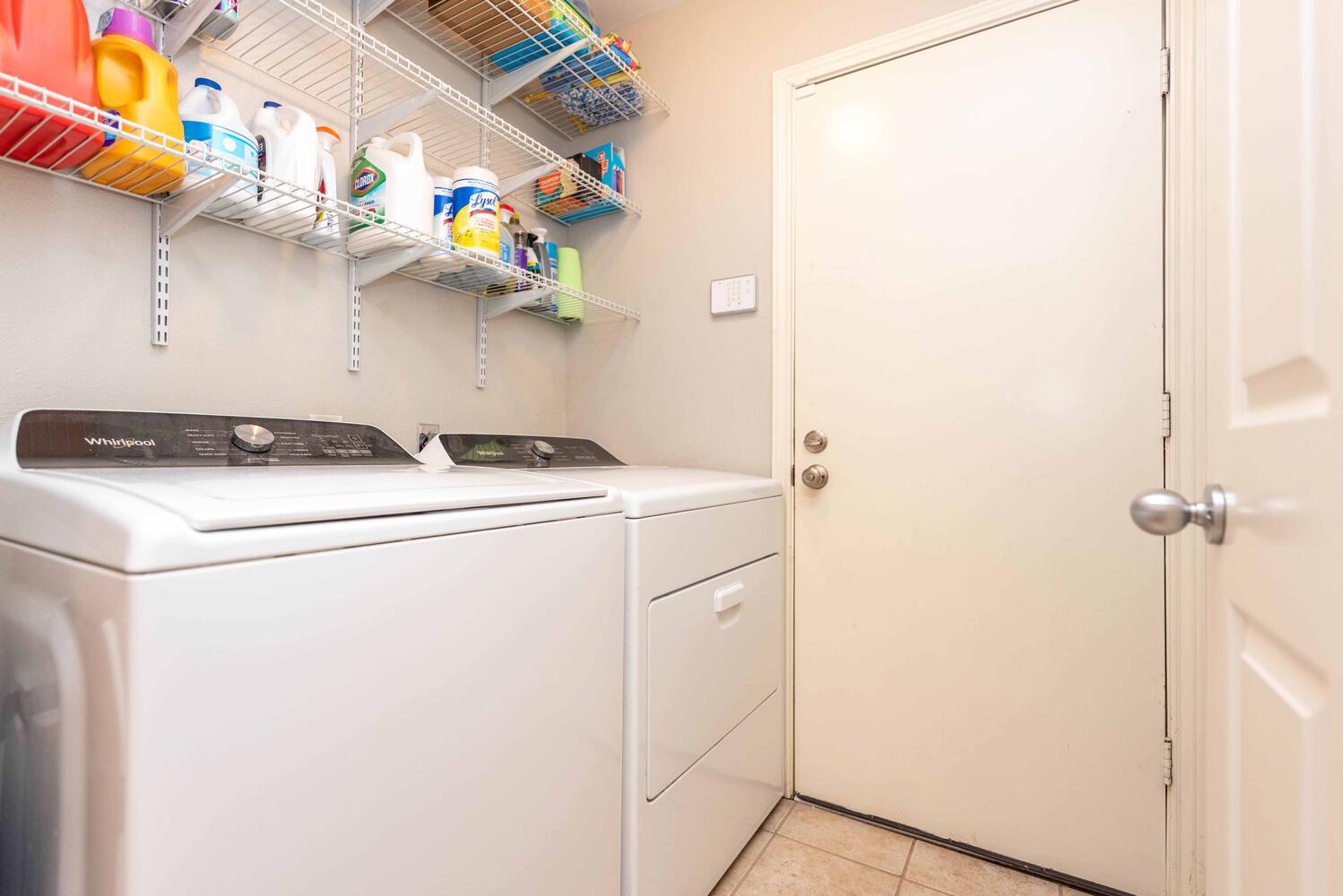 3403 Palomar Lane Austin, TX 78727 - Photo 29 of 33 Laundry room featuring light tile patterned floors and washing machine and clothes dryer