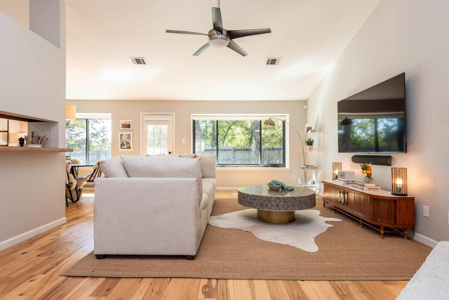 3403 Palomar Lane Austin, TX 78727 - Photo 5 of 33 Living room featuring ceiling fan, plenty of natural light, and light wood-style floors