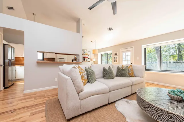 a living room with furniture and a large window