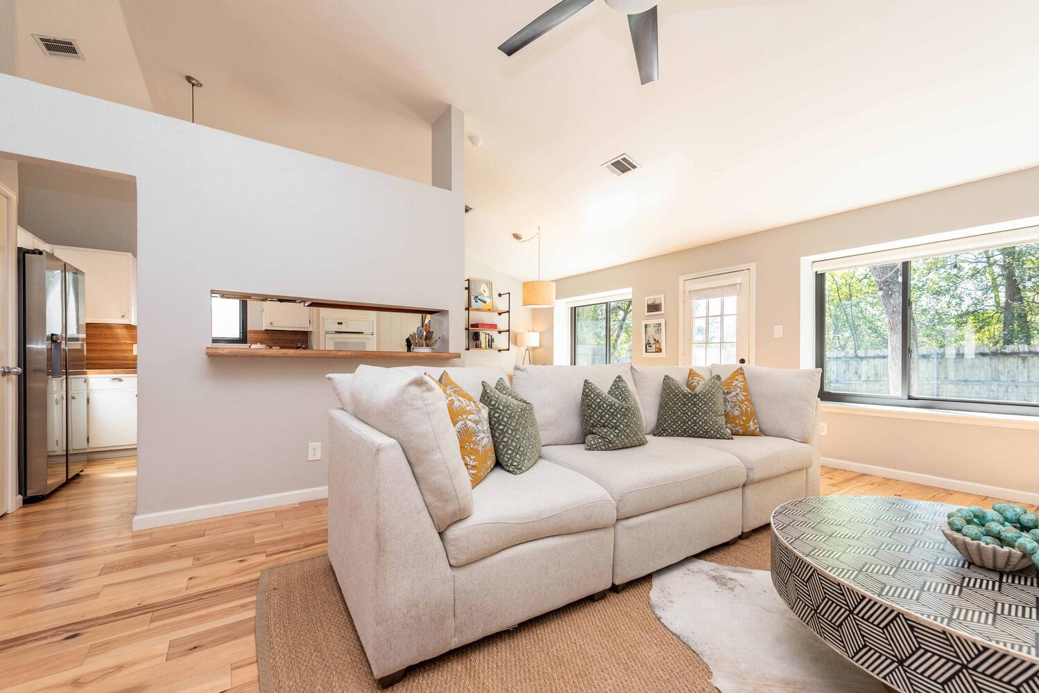 3403 Palomar Lane Austin, TX 78727 - Photo 8 of 33 Living area with light wood-style flooring, high vaulted ceiling, and a ceiling fan