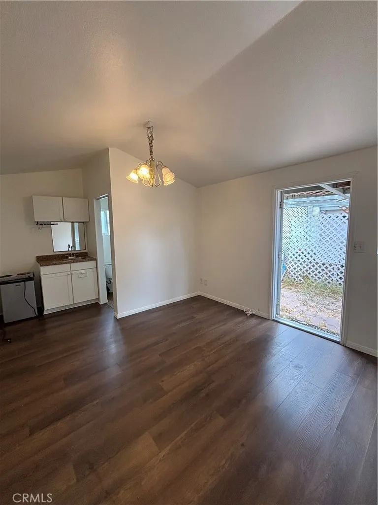 24627 Moon Avenue Lomita, CA 90717 - Photo 4 of 7 a view of empty room with wooden floor