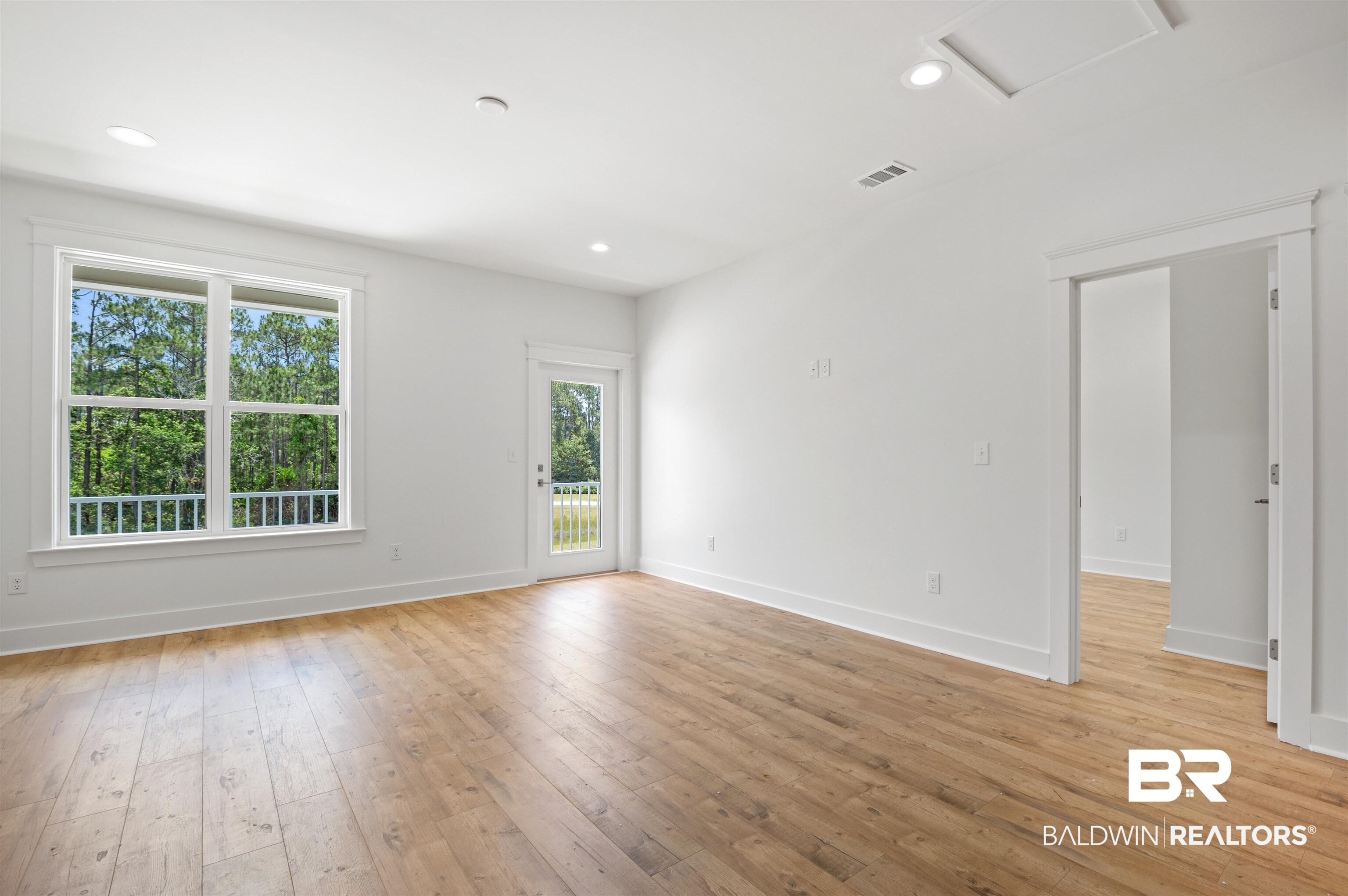 657 Island Way Gulf Shores, AL 36542 - Photo 26 of 59 Spare room with healthy amount of natural light, attic access, light wood finished floors, and recessed lighting