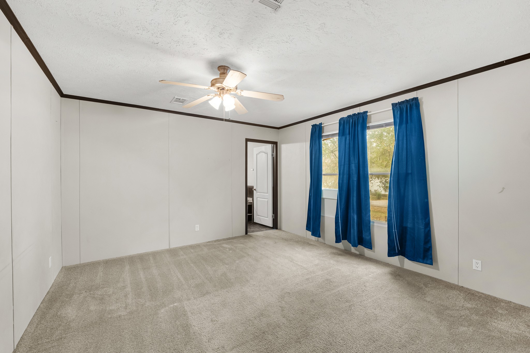 32 Oak Lake Trinity, TX 75862 - Photo 8 of 32 wooden floor in an empty room with a window