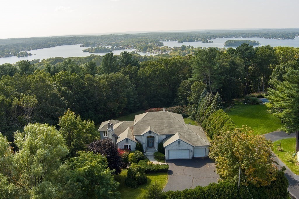 118 Upper Gore Road Webster, MA 01570 - Photo 1 of 38 an aerial view of a house with a yard and lake view