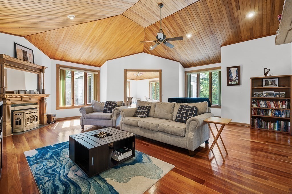 118 Upper Gore Road Webster, MA 01570 - Photo 17 of 38 a living room with furniture a fireplace and a wooden floor