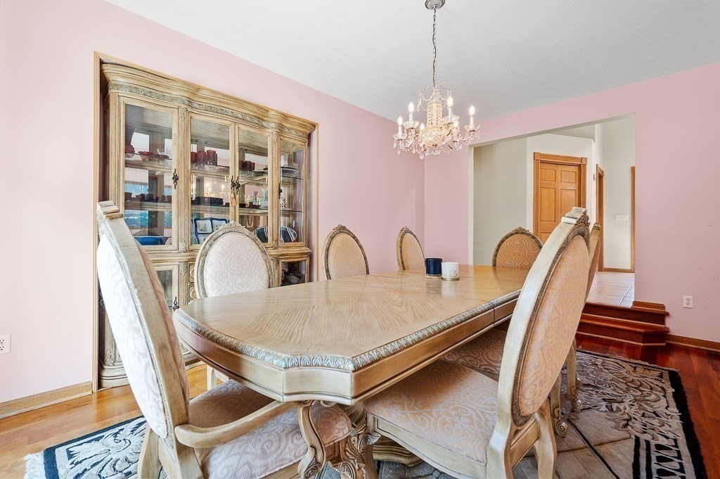 118 Upper Gore Road Webster, MA 01570 - Photo 22 of 38 a view of a dining room with furniture and chandelier