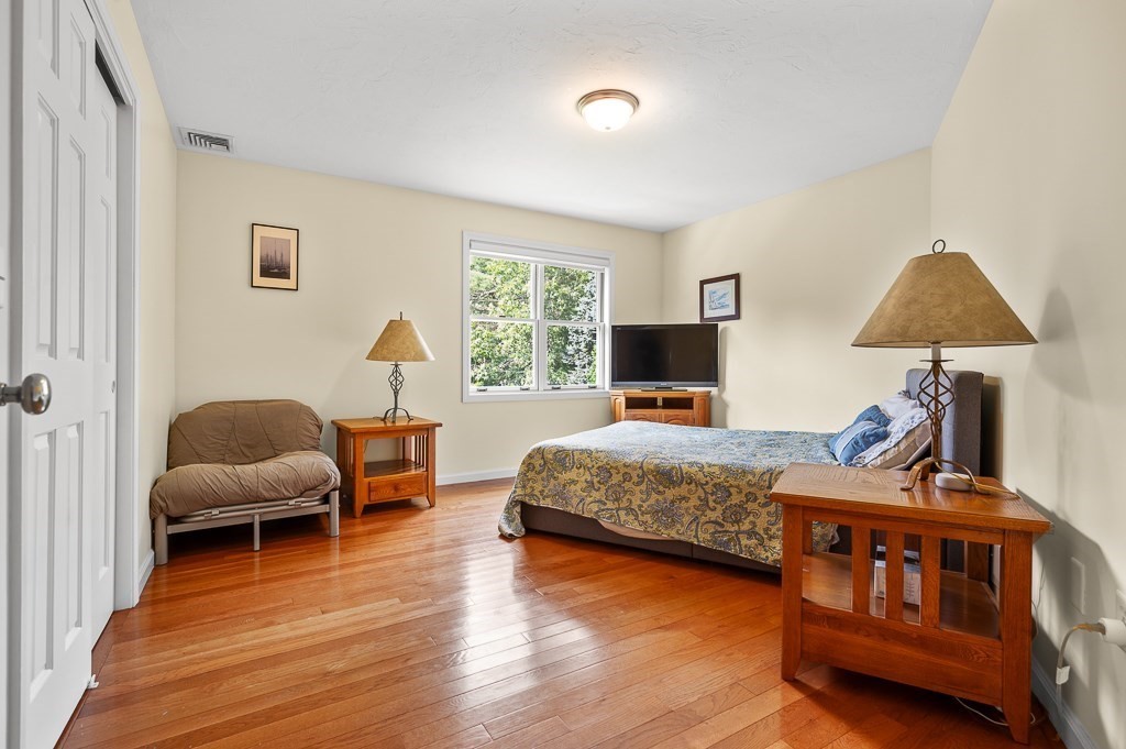 118 Upper Gore Road Webster, MA 01570 - Photo 29 of 38 a bedroom with bed and a flat screen tv