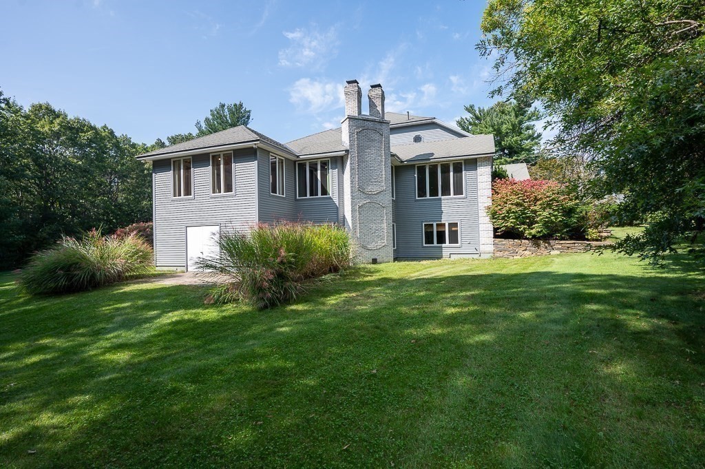 118 Upper Gore Road Webster, MA 01570 - Photo 5 of 38 a front view of a house with a garden