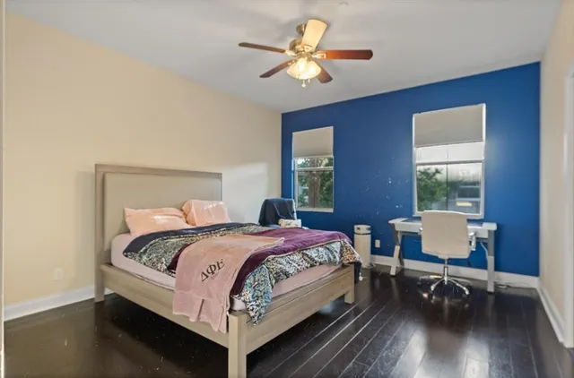 a bedroom with a bed and a table