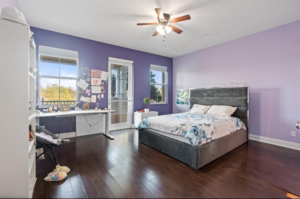 4025 Cascada Circle Hollywood, FL 33024 - Photo 7 of 19 a spacious bedroom with a bed and wooden floor