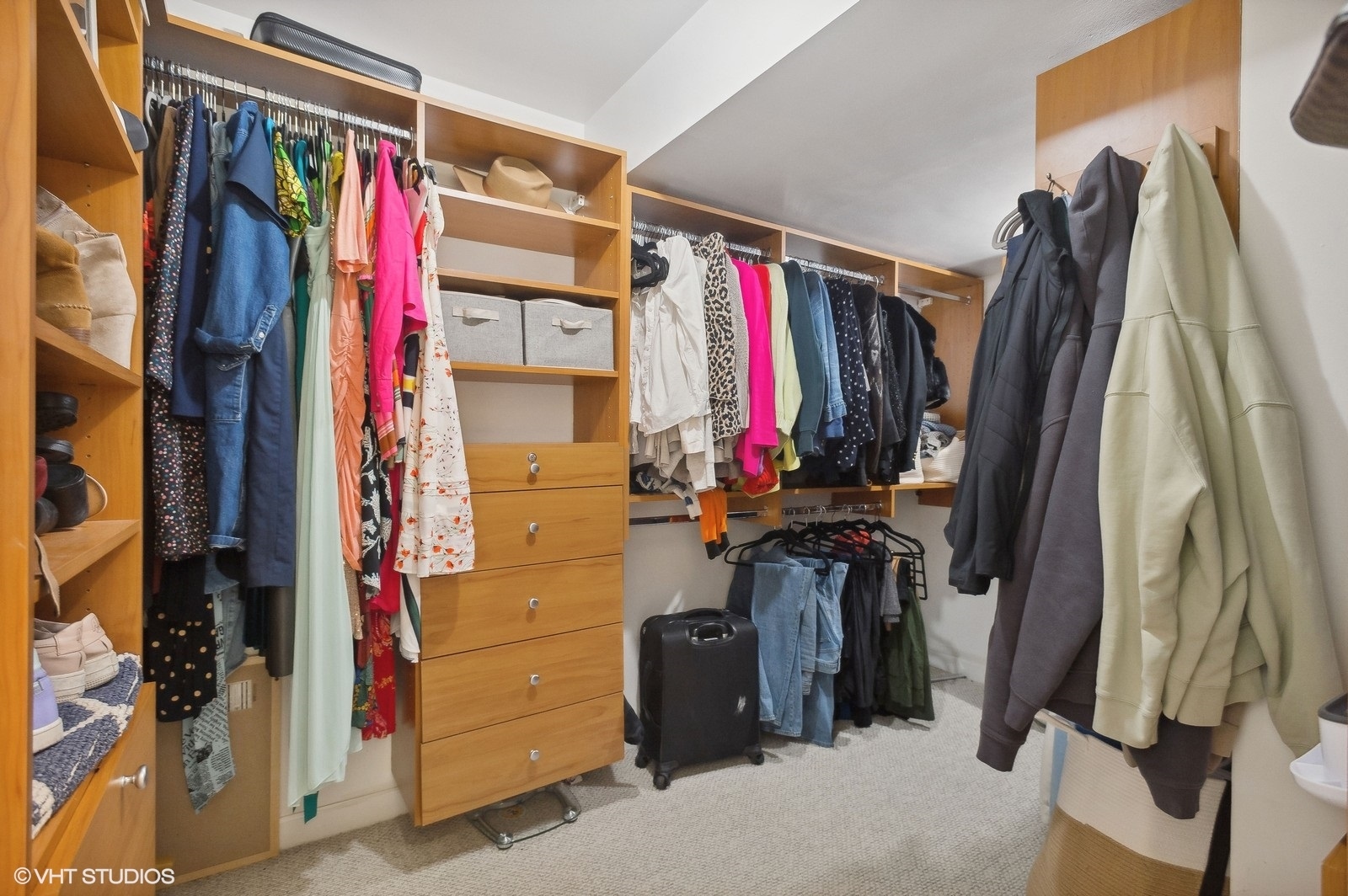 3838 North Wayne Avenue Chicago, IL 60613 - Photo 21 of 40 a view of walk in closet with clothes and shoes