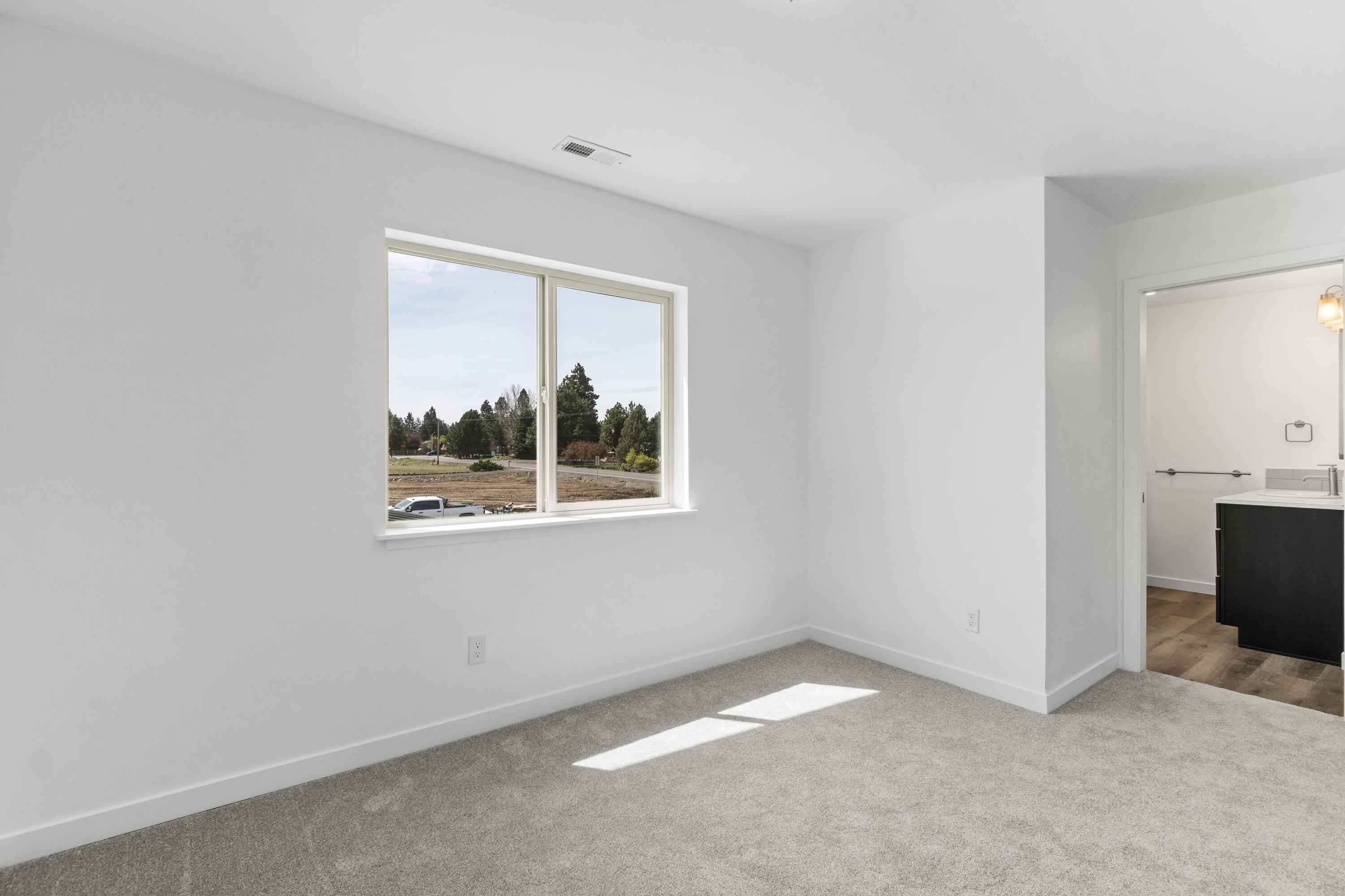 61646 Pettigrew Road, Unit 3 Bend, OR 97702 - Photo 11 of 13 a view of an empty room with a window