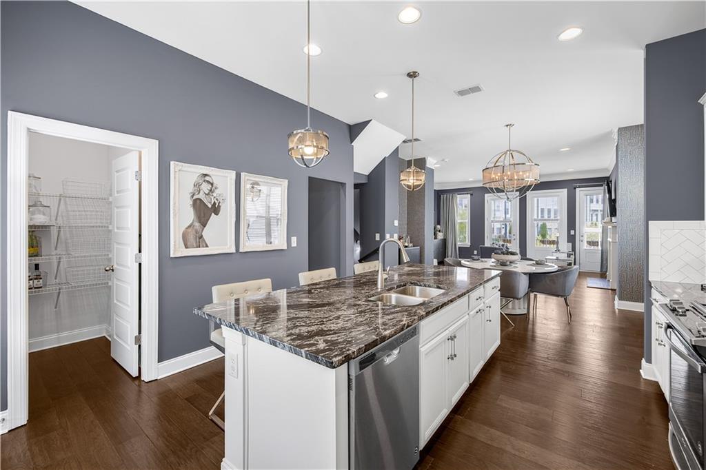 2013 Rockledge Road Northeast Atlanta, GA 30324 - Photo 13 of 50 an open kitchen with a table and chairs in it