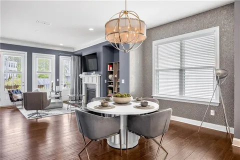a living room with furniture fireplace and flat screen tv