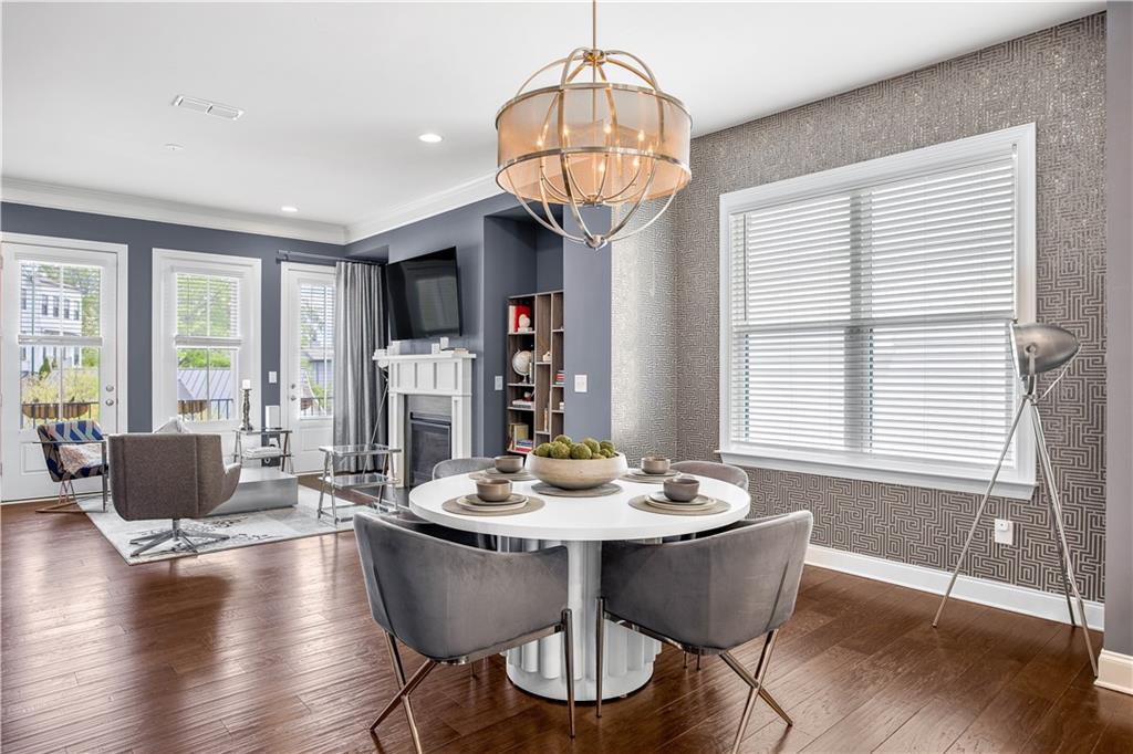 2013 Rockledge Road Northeast Atlanta, GA 30324 - Photo 16 of 50 a dining room with furniture wooden floor and a chandelier