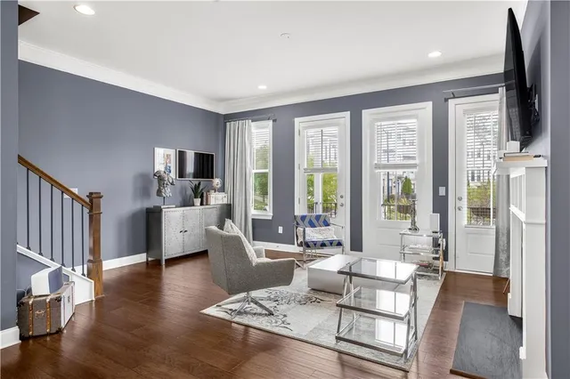 a living room with fireplace furniture and a flat screen tv