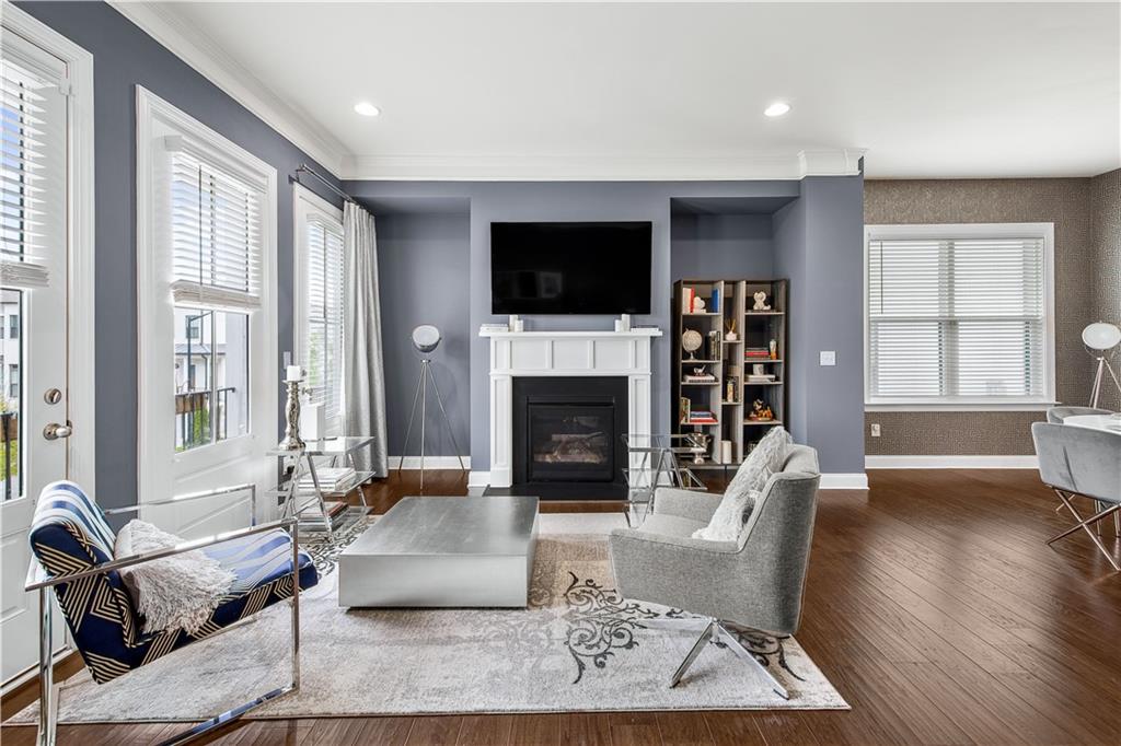 2013 Rockledge Road Northeast Atlanta, GA 30324 - Photo 20 of 50 a living room with furniture a flat screen tv and a fireplace