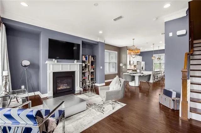 a lobby with furniture and a flat screen tv