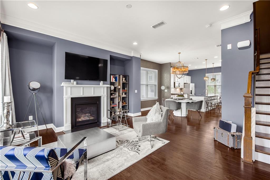 2013 Rockledge Road Northeast Atlanta, GA 30324 - Photo 21 of 50 a living room with furniture a flat screen tv and a fireplace