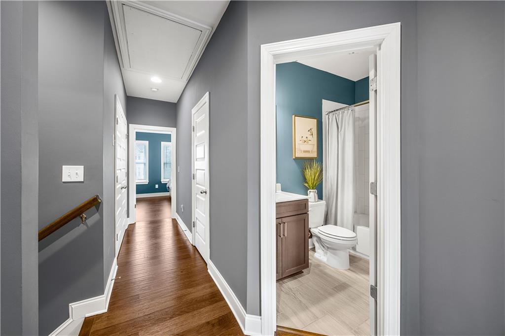 2013 Rockledge Road Northeast Atlanta, GA 30324 - Photo 24 of 50 a view of a hallway with wooden floor and a bathroom