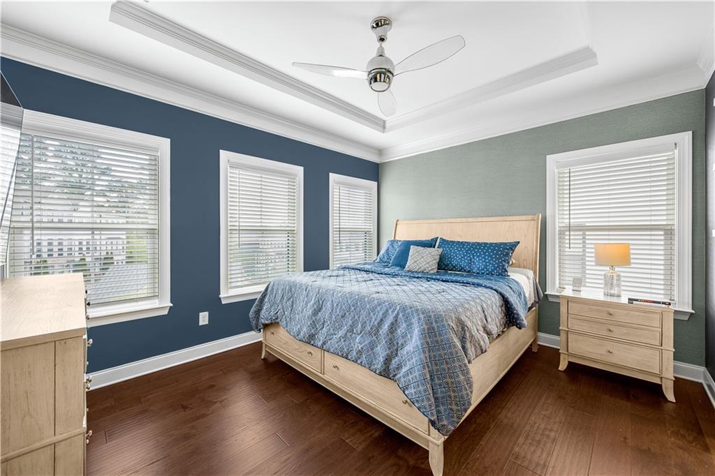 2013 Rockledge Road Northeast Atlanta, GA 30324 - Photo 25 of 50 a bedroom with a large bed and a large window with wooden floor