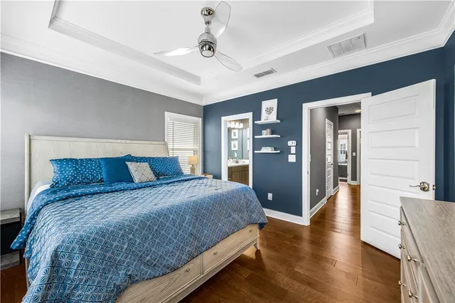 a bedroom with a bed and cabinets