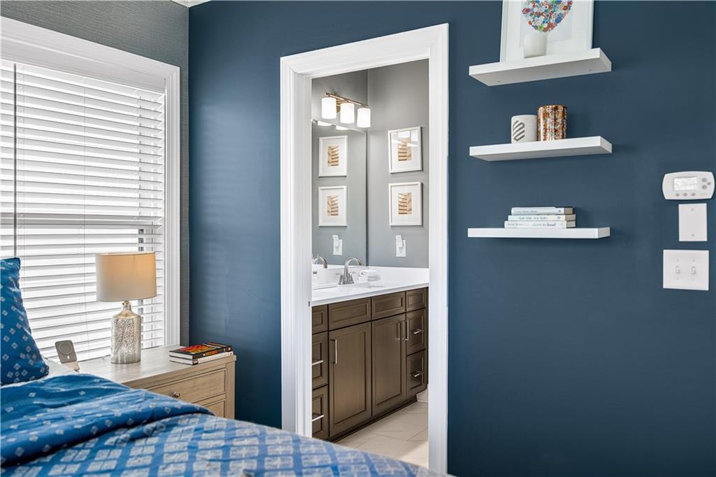 2013 Rockledge Road Northeast Atlanta, GA 30324 - Photo 27 of 50 a bedroom with a bed and cabinets