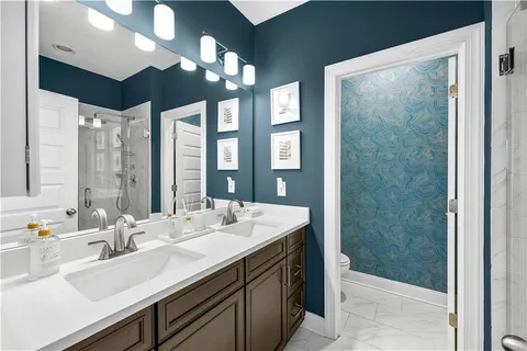 a bathroom with a glass shower door