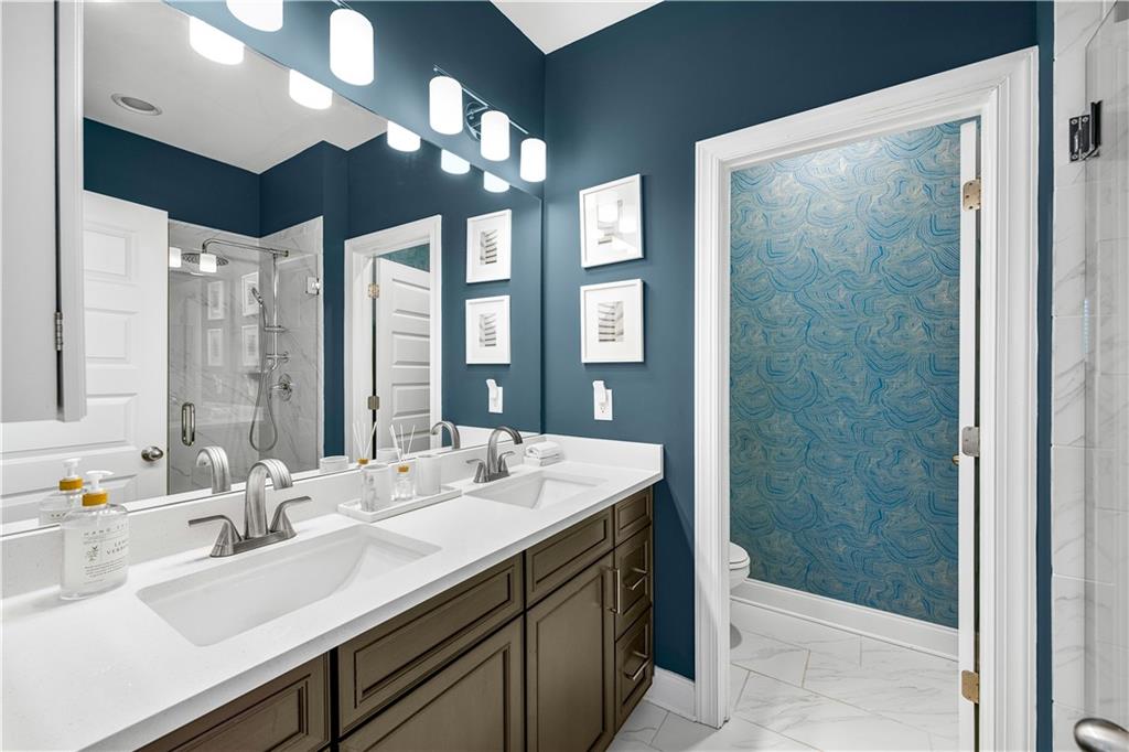2013 Rockledge Road Northeast Atlanta, GA 30324 - Photo 29 of 50 a bathroom with double sink and a mirror