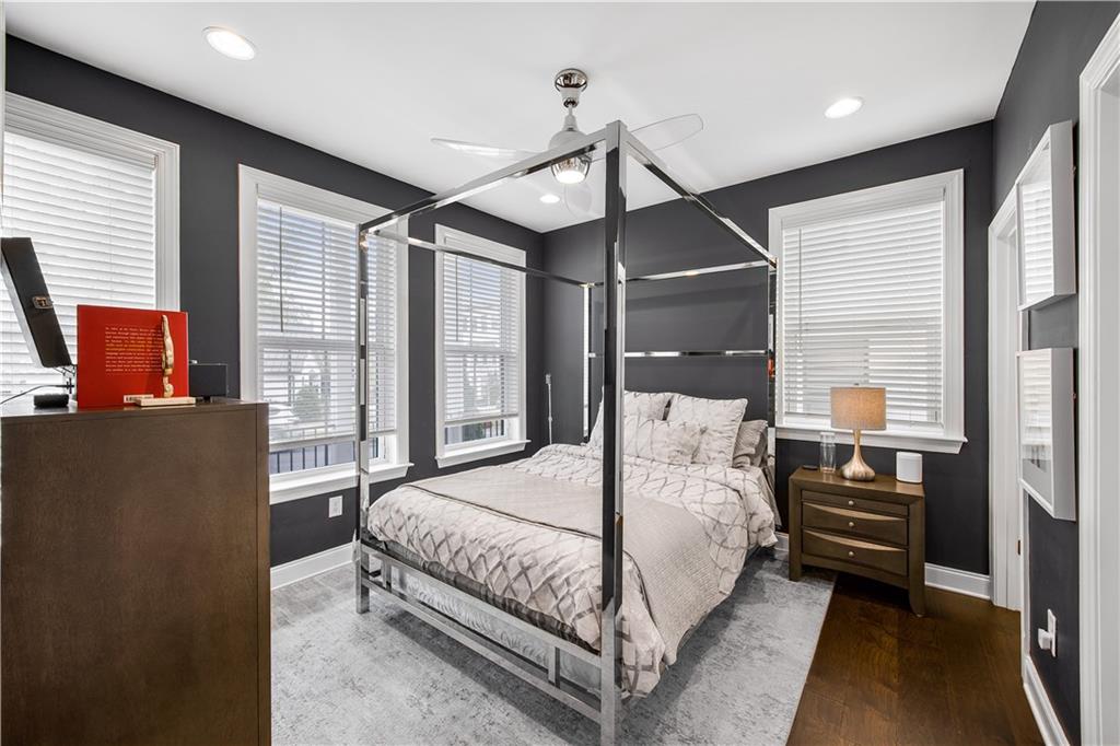 2013 Rockledge Road Northeast Atlanta, GA 30324 - Photo 40 of 50 a bedroom with a large bed and windows