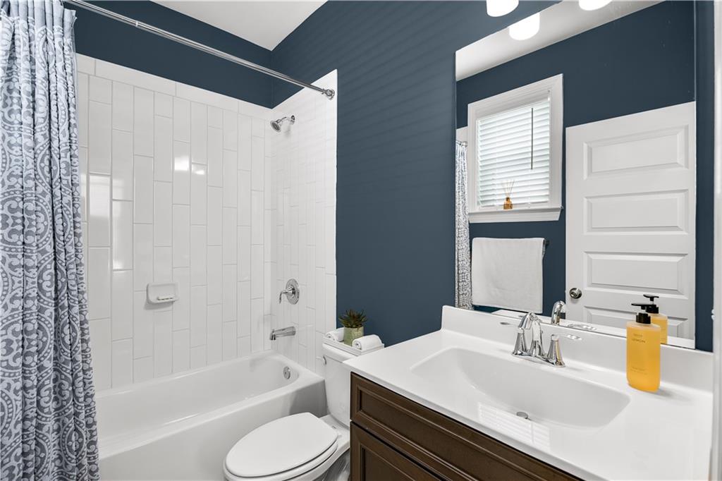 2013 Rockledge Road Northeast Atlanta, GA 30324 - Photo 43 of 50 a bathroom with a granite countertop sink toilet and shower