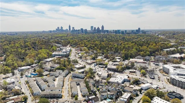 an aerial view of a building with parking