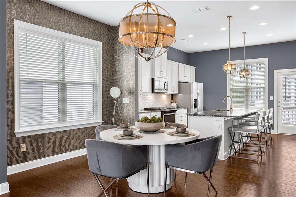 2013 Rockledge Road Northeast Atlanta, GA 30324 - Photo 7 of 50 a view of a dining room with furniture window and wooden floor