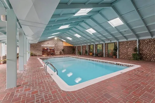 an aerial view of a house with swimming pool
