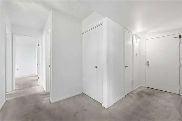 a view of an empty room with a balcony
