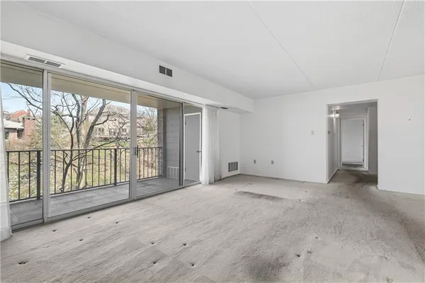 a view of an empty room with a window