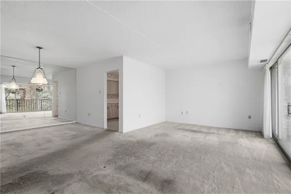 a view of empty room with floor to ceiling window