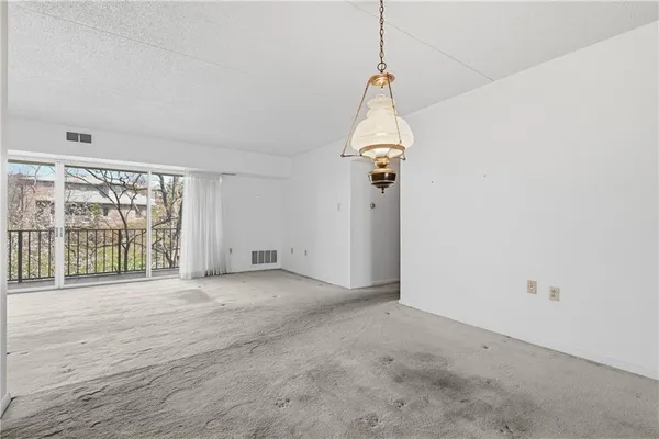 a view of empty room with windows