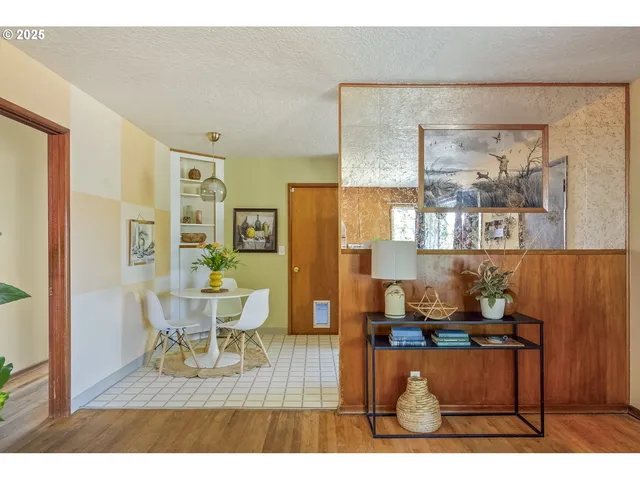 a living room with a couch and a dining table