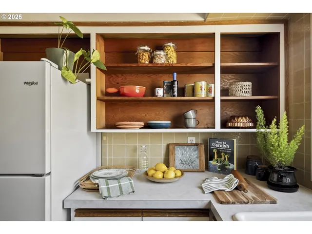 a view of a dining room with shelves