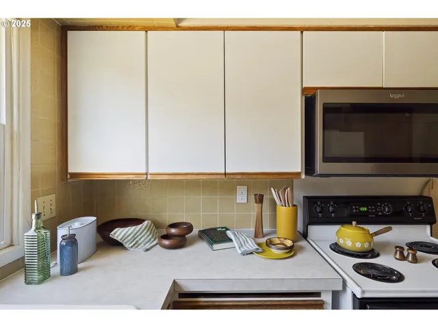 a kitchen with a sink and a microwave